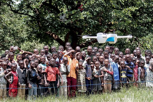 On 12 March 2016, children in Malawi look on amazed in the community demonstration of Unmanned Aerial Vehicles (UAVs or drones) flying in Lilongwe. The Ministry of Health and UNICEF launched the first 10km auto programmed flight in a trial to speed up the testing and diagnosis of HIV in infants. Malawi has a national HIV prevalence rate of 10% - still one of the highest in the world. An estimated 1 million Malawians were living with HIV in 2013 and 48,000 died from HIV-related illnesses in the same year. Whilst progress has been made, and today 90% of pregnant women know their HIV status, there is still a drop off with testing and treating babies and children. In 2014, around 10,000 children in Malawi died from HIV-related diseases and less than half of all children were on treatment. Samples are currently transported by road, either by motorbike or local authority ambulances. Various factors including the high cost of diesel fuel, poor state of roads and limited distribution schedules have resulted in extreme delays in lab sample transport, constituting a significant impediment for the scaling up of paediatric ARTís effectiveness. In March 2016, the Government of Malawi and UNICEF have started testing the use of Unmanned Aerial Vehicles (UAVs or drones) to explore cost effective ways of reducing waiting times for HIV testing of infants. The test, which is using simulated samples, will have the potential to cut waiting times dramatically, and if successful will be integrated into the health system alongside others mechanisms such as road transport and SMS. The first successful test flight completed the 10km route unhindered travelling from a community health centre to the Kamuzu Central Hospital laboratory. Local residents gathered in amazement as the vehicle took off and flew away in the direction of the hospital. The test flights which are assessing viability including cost and safety, will continue until Friday 18th March. The UAV flights are suppo