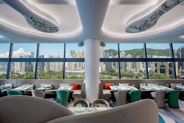 The interior of the open-air bar restaurant SKYE Roofbar and Dining has a panoramic view of the sky from the window.